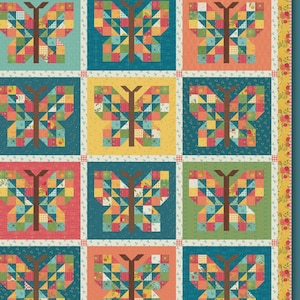 May include: A colorful patchwork quilt featuring butterfly designs. Each butterfly is composed of various fabric squares in shades of blue, orange, green, and yellow. The quilt is approximately 10 inches square and is fat eighth and fat quarter friendly. The quilt is labeled "MARIPOSA" and "Anka's Treasures".