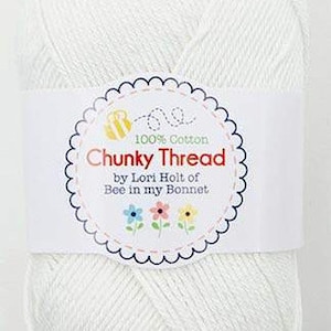 May include: A white ball of 100% cotton yarn labeled "Chunky Thread by Lori Holt of Bee in my Bonnet".