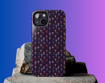 May include: A black phone case with a pattern of colorful crosses on a dark purple background.