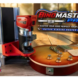 May include: A red and silver BindMaster Pro guitar binding router jig mounted on a vertical stand, positioned next to a sunburst electric guitar. The device features a compact router, metal guide rails, and text reading Master Your Edge Perfect Your Craft.