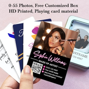 May include: A set of 55 customizable playing cards featuring a makeup artist's business card with a photo of a woman applying makeup. The card includes the artist's name, "Sophia Williams", makeup artist title, phone number, social media information, and website address. The card is printed on high-quality playing card material.