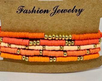 Set di braccialetti con perline Heishi arancioni: accenti dorati, braccialetti impilabili