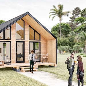 K&ouml;nnte beinhalten: Eine 3D-Darstellung einer kleinen, modernen H&uuml;tte mit schwarzer Au&szlig;enfassade und Holzinnenausstattung. Die H&uuml;tte hat ein gro&szlig;es Fenster an der Vorderseite und eine kleine Veranda mit einem Tisch und St&uuml;hlen. Der Text "DELIVERY INCLUDES:" ist auf der rechten Seite des Bildes mit einer Liste der im Kauf enthaltenen Artikel aufgef&uuml;hrt.
