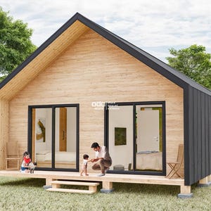 K&ouml;nnte beinhalten: Eine kleine, moderne H&uuml;tte mit einer Holzfassade und einem schwarzen Dach. Die H&uuml;tte hat gro&szlig;e Fenster und eine Terrasse mit einem Gel&auml;nder. Drei Personen stehen auf der Terrasse, darunter zwei Kinder.