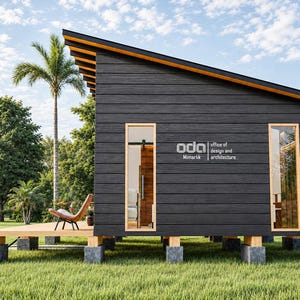 May include: A small, dark-sided cabin with a slanted roof, elevated on concrete block piers. The exterior features horizontal wood siding, two tall rectangular windows, and a wooden deck. The text "oda office of design and architecture" is visible.