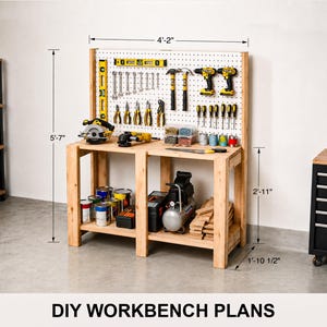 May include: A wooden workbench with a pegboard back panel, featuring various power and hand tools. Dimensions are labeled as 4 feet 2 inches wide, 5 feet 7 inches high, 2 feet 11 inches high for the table surface, and 1 foot 10.5 inches deep.