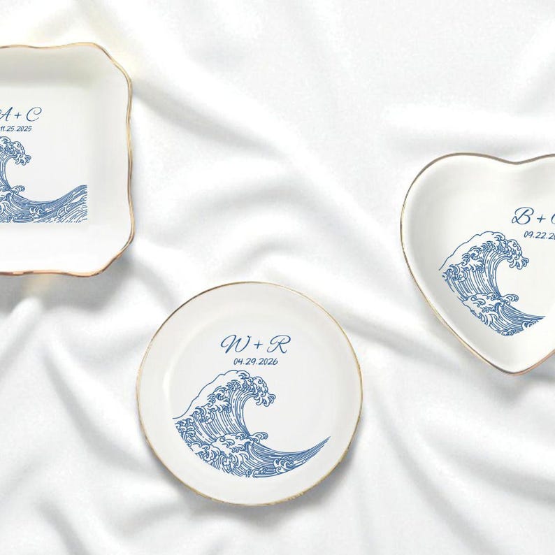 May include: A set of three ceramic mugs with a speckled, matte finish. The mugs are in shades of cream, light gray, and dark gray. Each mug has a simple, minimalist design, perfect for coffee or tea.