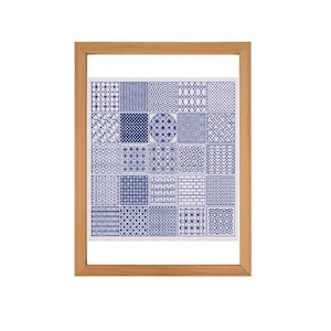 May include: A framed print featuring a white background with 25 blue geometric patterns arranged in a grid.