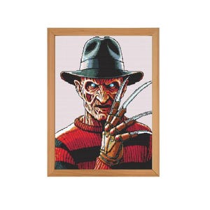 May include: A red and black striped sweater with a brown hat and a glove with sharp blades. The character has a menacing expression.