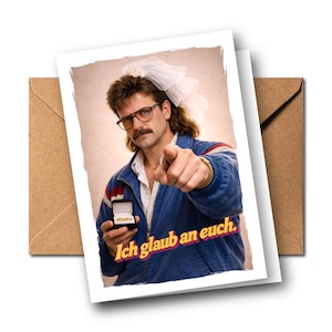 May include: A greeting card featuring a person with a mullet hairstyle wearing a white bridal veil, glasses, and a blue jacket. The person holds an open black ring box and points forward. The text Ich glaub an euch is printed in yellow.
