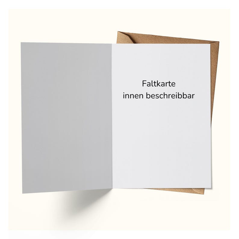 May include: An open, blank greeting card with a white interior and a gray left panel. The right panel has the text "Faltkarte innen beschreibbar" in black. The card is inside a brown envelope.
