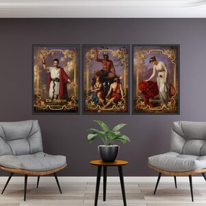 May include: Three framed tarot card prints. The prints feature classical artwork with gold ornate frames. The cards are labeled "The Magician", "The Devil", and "Strength". The artwork has a vintage aesthetic and is displayed on a dark gray wall.