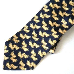 May include: A navy blue silk tie with a repeating pattern of yellow sheep.