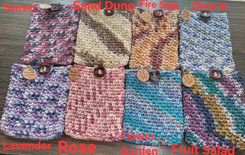 May include: Ten crocheted pot holders with different color patterns and wooden buttons. The pot holders are labeled with names like "Sunset", "Sand Dune", "Fire Side", "Dive In", "Lavender", "Rose", "Flower Garden", "Fruit Salad".