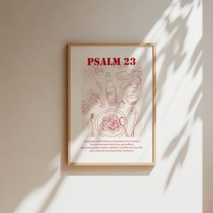 May include: A printable poster featuring a red and white illustration of a table setting with food and wine. The text "PSALM 23" is at the top of the poster. The text below the illustration reads: "You prepare a table before me in the presence of my enemies. You anoint my head with oil; my cup overflows. Surely your goodness and love will follow me all the days of my life, and I will dwell in the house of the Lord forever."