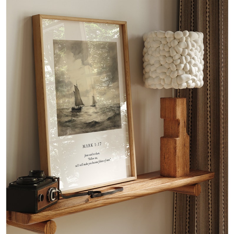 May include: A framed print of a vintage illustration of a sailboat on the water with the text "MARK 1:17 Jesus said to them, "Follow me, and I will make you become fishers of men."