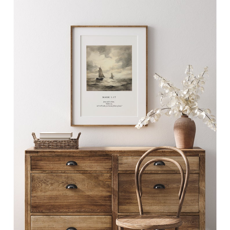 May include: A framed print with a watercolor painting of two sailboats on the water. The print includes the text "Mark 1:17" and a bible verse.
