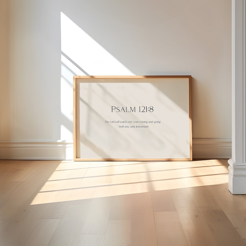 May include: A framed print with a white background and black text. The text reads "PSALM 121:8" and "The Lord will watch over your coming and going, both now and forevermore."
