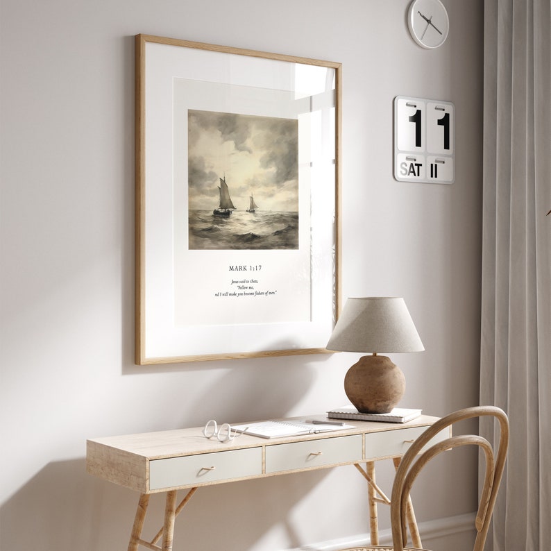 May include: A framed print with a watercolor painting of two sailboats on the water. The print has a white background with a black text overlay that reads "Mark 1:17 Jesus said to them, "Follow me, and I will make you fishers of men."