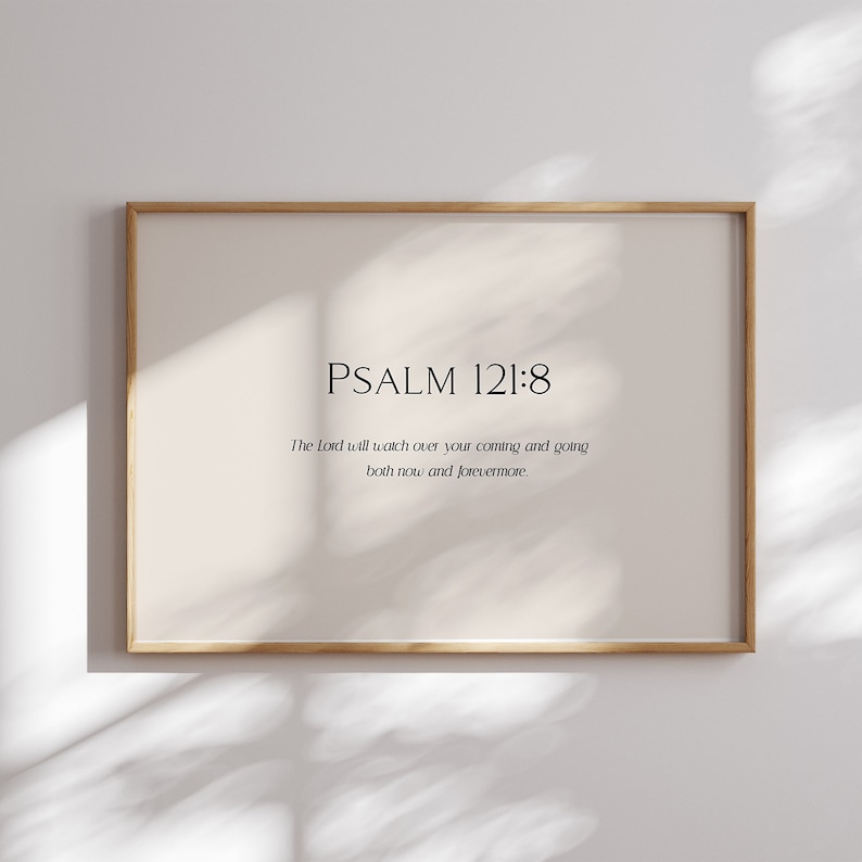 May include: A framed print with a white background and black text. The text reads "PSALM 121:8" and "The Lord will watch over your coming and going both now and forevermore."