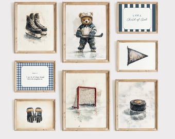 May include: A gallery wall of eight framed prints with a hockey theme. The prints feature a teddy bear playing hockey, a hockey net, a hockey puck, a pair of hockey gloves, a hockey skate, a pennant with the words "Go Team" and a framed scripture verse. The prints are all in a watercolor style and have a blue and white color scheme.