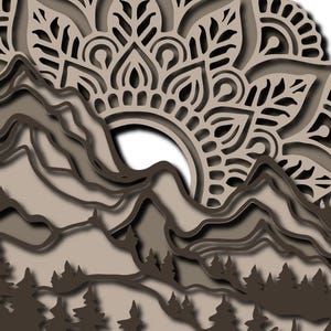 May include: A multi-layered wall art piece featuring a mountain range and a forest of pine trees at the base. Above the mountains, a large, intricate mandala pattern is displayed in shades of light and dark brown, creating a dimensional effect.