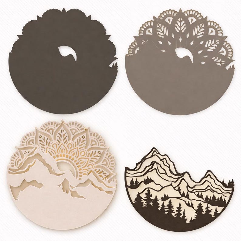 May include: Four circular wall art pieces featuring layered laser-cut designs. Two pieces display intricate mandala patterns above mountain silhouettes, one shows a mountain range with pine trees, and one is a solid dark brown circle.