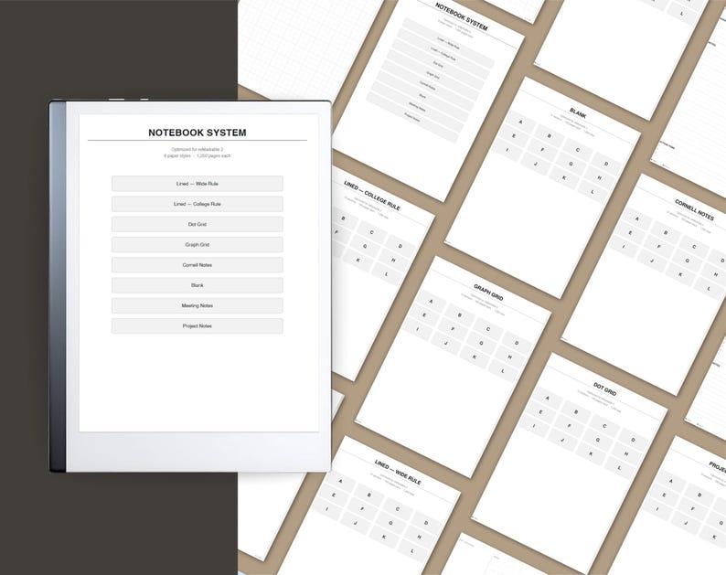a collection of blank notebooks and planners arranged in a grid-like pattern, with a notebook titled "Notebook System 2" placed on a dark surface.