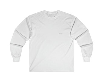 May include: White long-sleeved t-shirt with the word "Seen" printed on the front.