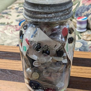 Vintage buttons and a Jar.