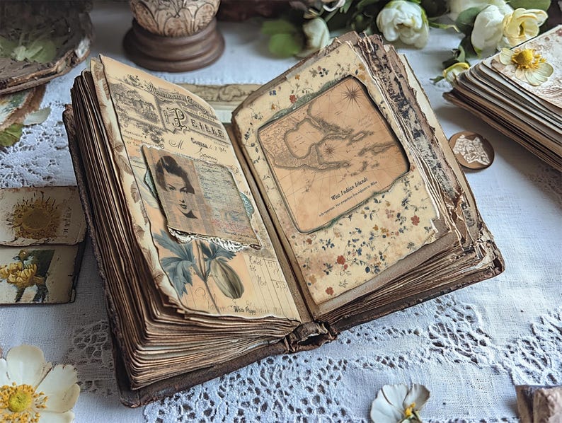 May include: An antique, leather-bound journal with aged pages and decorative elements. The journal is open to reveal a map of the West Indies Islands and a vintage photograph of a woman.