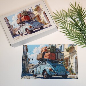 May include: A blue vintage Volkswagen Beetle with a stack of luggage on the roof driving down a narrow street in a European village.