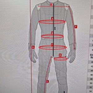 May include: Diagram showing measurements for a racing suit. The measurements are labeled with letters A through J. The suit is gray and has red lines indicating the measurements.