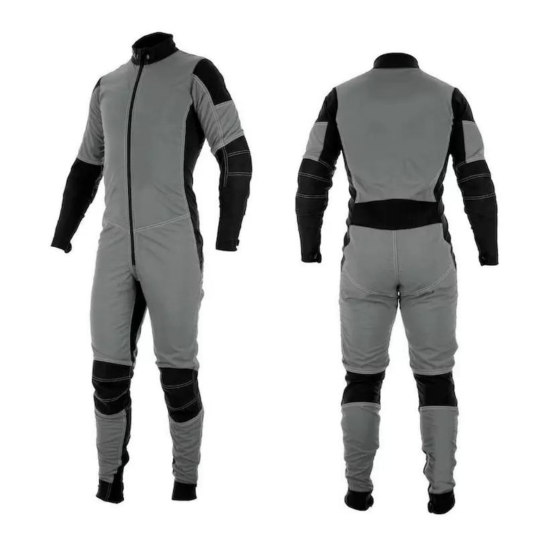 May include: A grey and black jumpsuit with a zip up the front. The jumpsuit has long sleeves and is shown from the front and back.