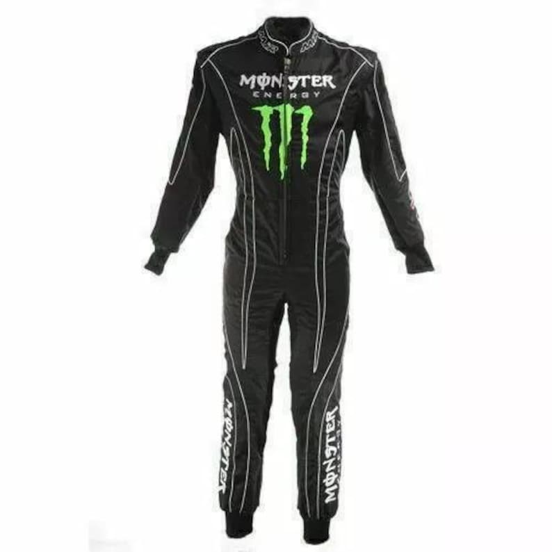 May include: Black racing suit with white accents and the Monster Energy logo in green. The suit has the word "Monster" written down the legs in white.