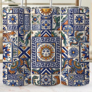 May include: A set of three stainless steel tumblers with a vibrant, repeating tile pattern. The design features a mix of blue, yellow, and orange squares with sun faces, birds, and animal motifs. Each tumbler has a silver straw.