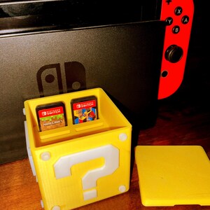Bloque de preguntas de Mario - Alta calidad - Almacenamiento de juegos de Nintendo Switch Soporte de 10 cartuchos amarillo Accesorio de jugador Mario Retro Plástico Juegos