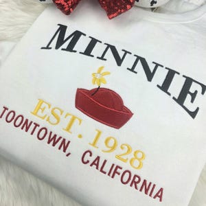 Minnie Mouse Varsity Embroidered Sweatshirt