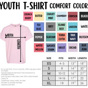 May include: A light pink youth t-shirt with measurements and color swatches. The shirt's width is 13 1/2 inches and length is 18 1/2 inches for size XS. Color options include Crunch Berry, Butter, Chalky Mint, and more. The shirt is made of soft ring-spun cotton.