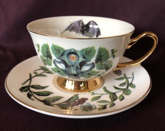 Juego de tazas de té doradas con diseño de felino