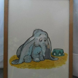 May include: A framed illustration of a sad-looking gray elephant with large ears, sitting on a yellow background with a green and white striped circus ring in the background.