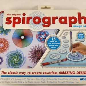 May include: A Spirograph design set in a rectangular tin. The box features the text "the original Spirograph design set" in red and white. The set includes 9 pieces, 2 pens, a guide book, design pad, and putty. Ages 8+.