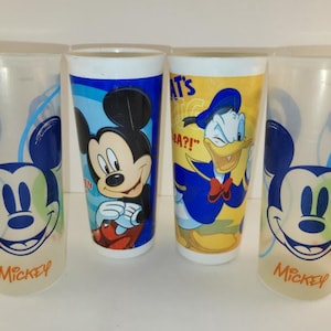 May include: A set of three ceramic mugs with a speckled, matte finish. The mugs are in shades of cream, light gray, and dark gray. Each mug has a simple, minimalist design, perfect for coffee or tea.