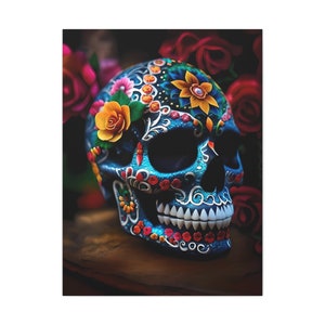 May include: A blue sugar skull with colorful floral and geometric designs. The skull is decorated with red, yellow, orange, green, and blue flowers.