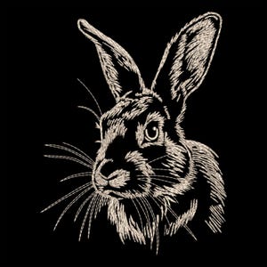 May include: A black and white embroidered image of a rabbit's head with a detailed, textured look. The rabbit has a long nose, large ears, and a single eye visible.