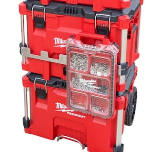 May include: A red Milwaukee Packout tool box with a clear plastic organizer attached to the side. The organizer has multiple compartments and is filled with small screws and other hardware.