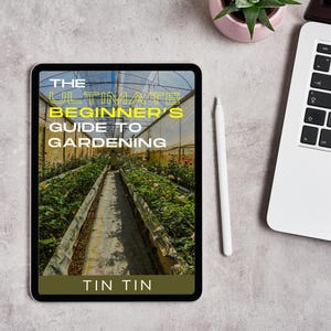 May include: A tablet displays the cover of "The Ultimate Beginner's Guide to Gardening" with a greenhouse image. A white stylus and a laptop are nearby, along with a small potted plant. The text "TIN TIN" is at the bottom.