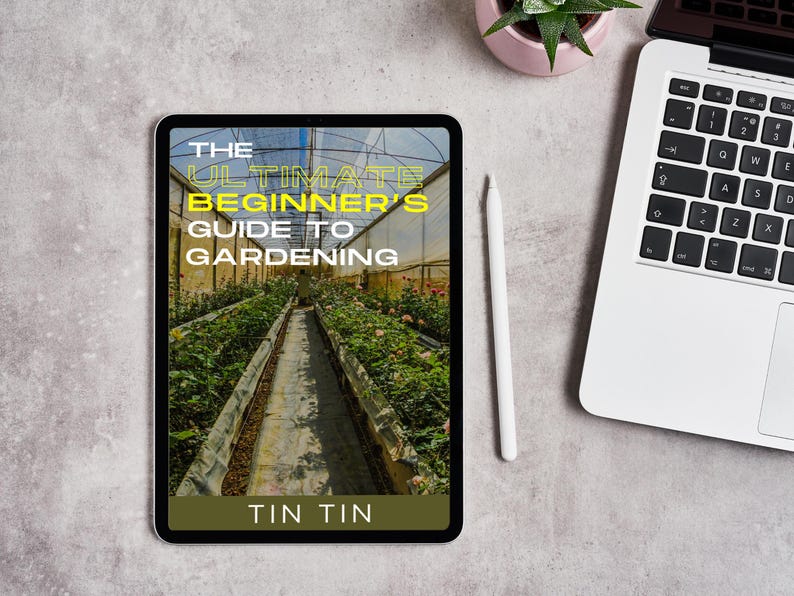 May include: A tablet displays the cover of "The Ultimate Beginner's Guide to Gardening" with a greenhouse image. A white stylus and a laptop are nearby, along with a small potted plant. The text "TIN TIN" is at the bottom.