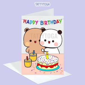May include: A birthday card featuring a brown bear and a panda bear holding a birthday cake with candles and sprinkles. The card has a pink background and the text "Happy Birthday" in colorful letters.