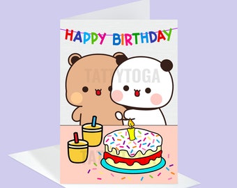 May include: A birthday card featuring a brown bear and a panda bear holding a birthday cake with candles and sprinkles. The card has a pink background and the text "Happy Birthday" in colorful letters.